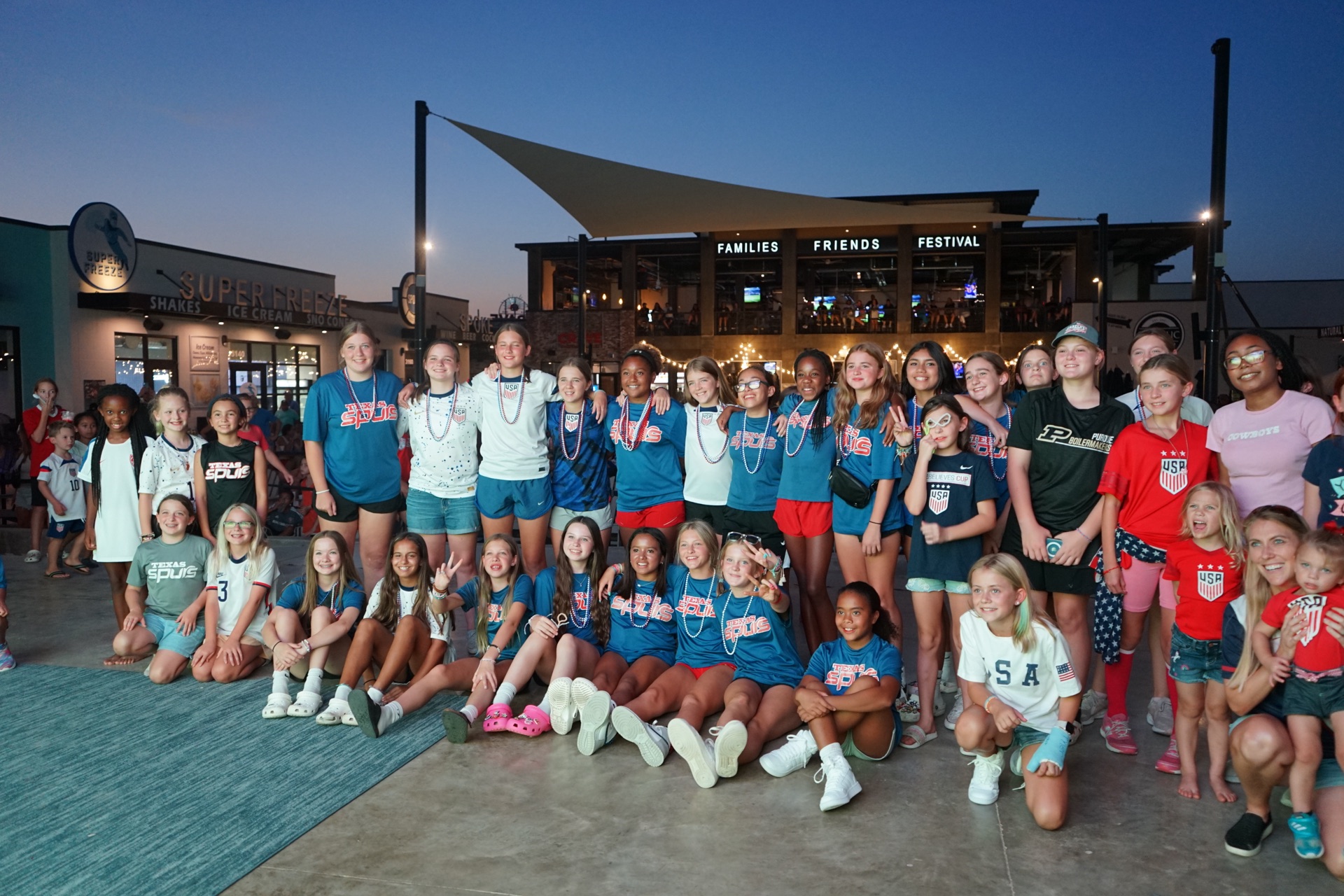 Youth soccer team on stage at The HUB — family friendly venue